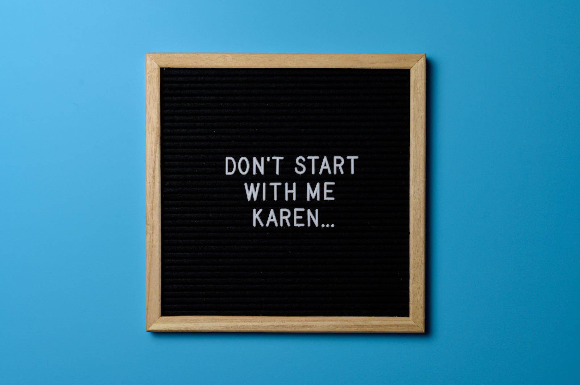 brown wooden framed don t start with me karen poster